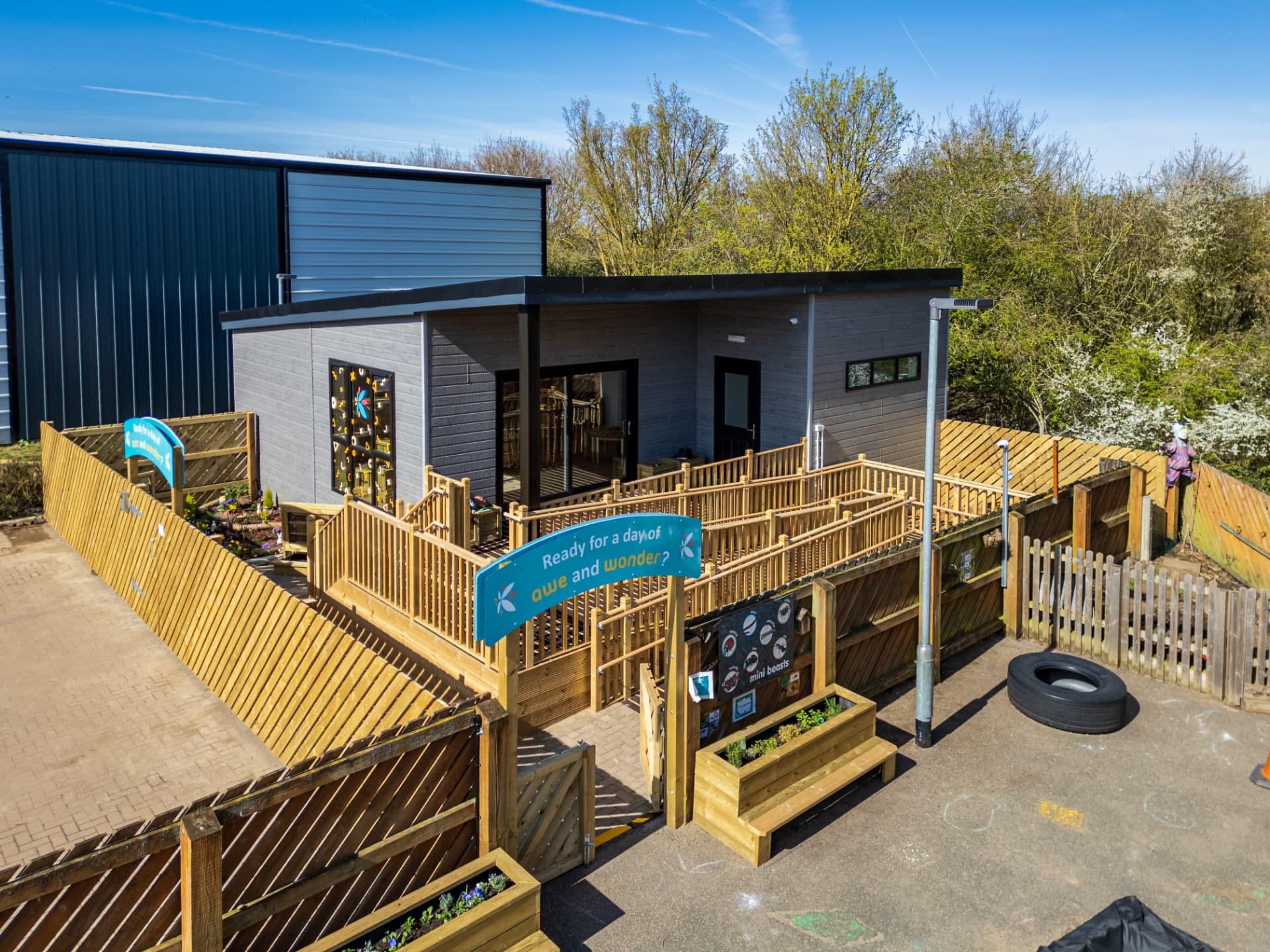 A completed modular nursery building with decked outdoor play area